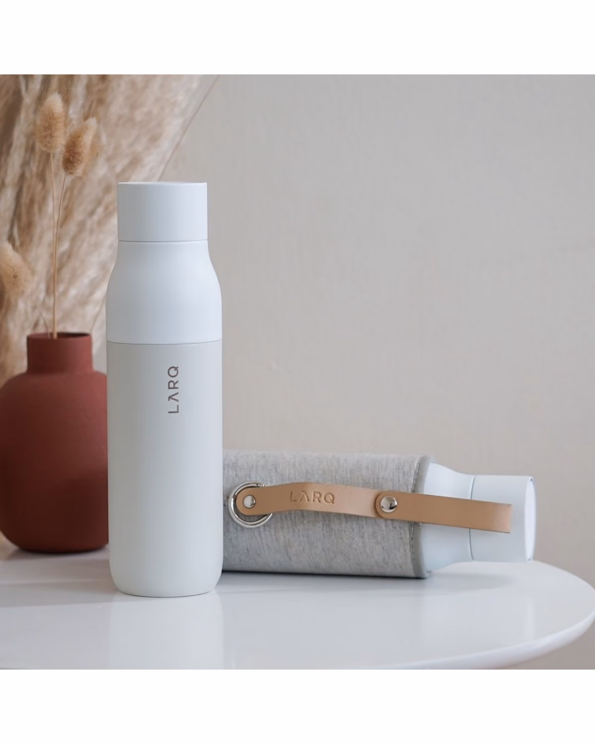 Custom LARQ Travel Sleeve, Granite White, on a bottle